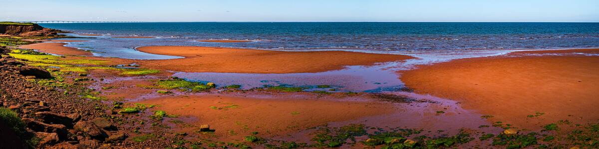 Seascape on Chelton Beach Provincial Park with the view of Confederation Bridge over Northumberland Strait of the Gulf of St Lawrence in Albany, Prince Edward Island, Canada