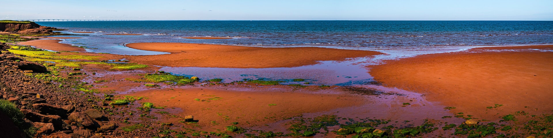 Seascape on Chelton Beach Provincial Park with the view of Confederation Bridge over Northumberland Strait of the Gulf of St Lawrence in Albany, Prince Edward Island, Canada