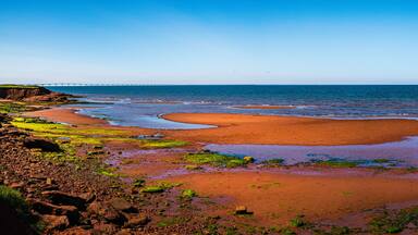 Seascape on Chelton Beach Provincial Park with the view of Confederation Bridge over Northumberland Strait of the Gulf of St Lawrence in Albany, Prince Edward Island, Canada