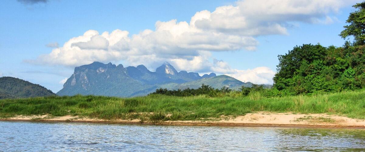 A river with mountains in the background.