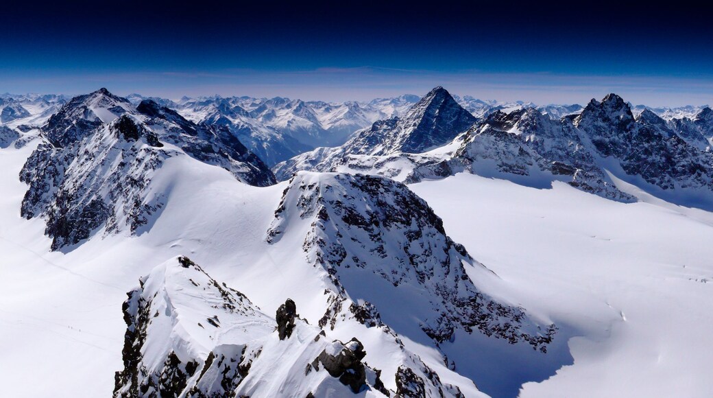 fantastic winter mountain panorama with a view of the high peaks and glaciers of the Silvretta mountains in the Swiss Alps on a beautiful winter day