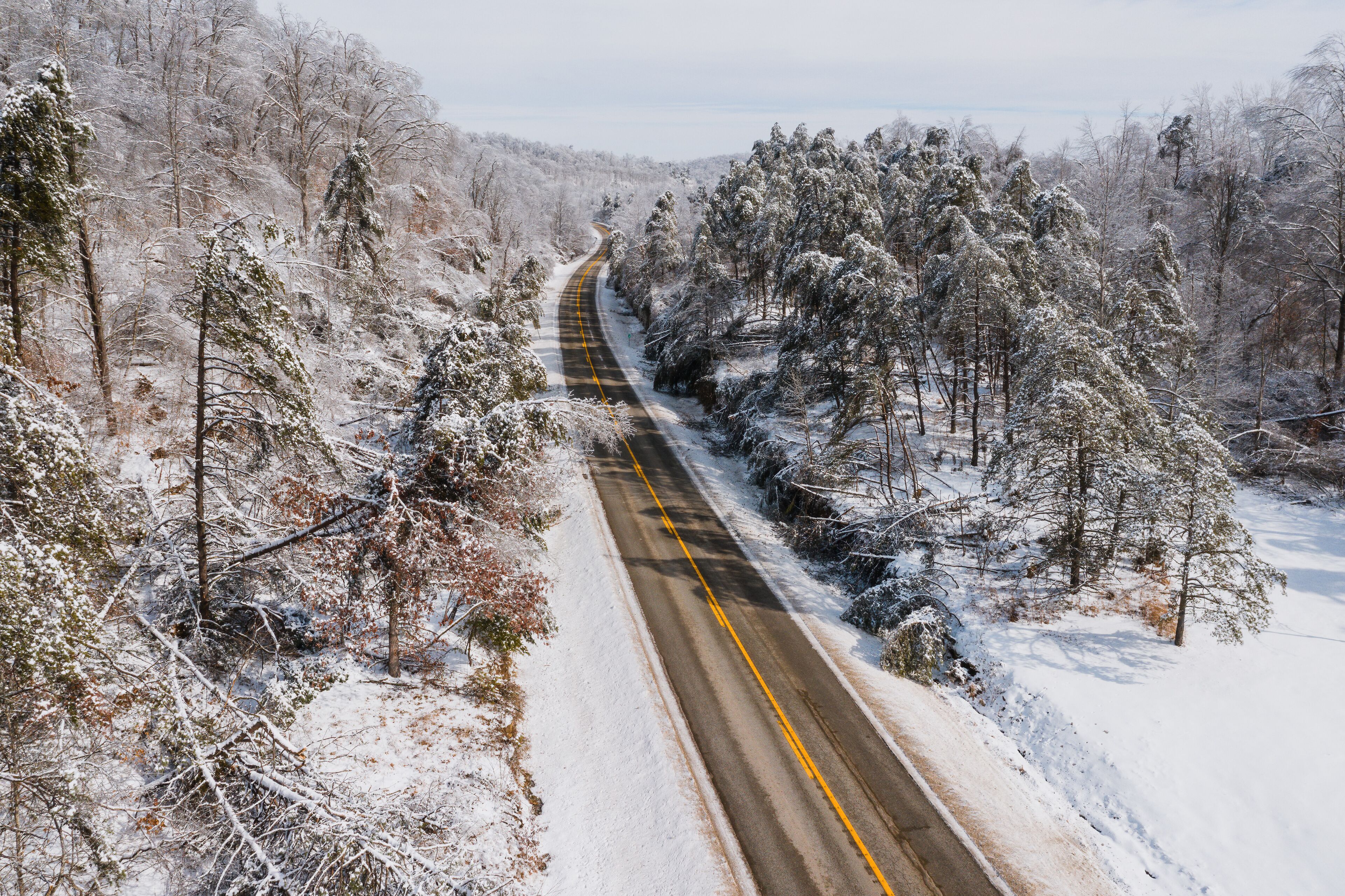 Aerial of KY Route 7 Surrounded by Snow Covered Forests - Grayson Lake State Park - Appalachian Mountains of Eastern Kentucky