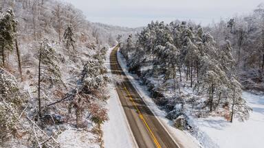 Aerial of KY Route 7 Surrounded by Snow Covered Forests - Grayson Lake State Park - Appalachian Mountains of Eastern Kentucky