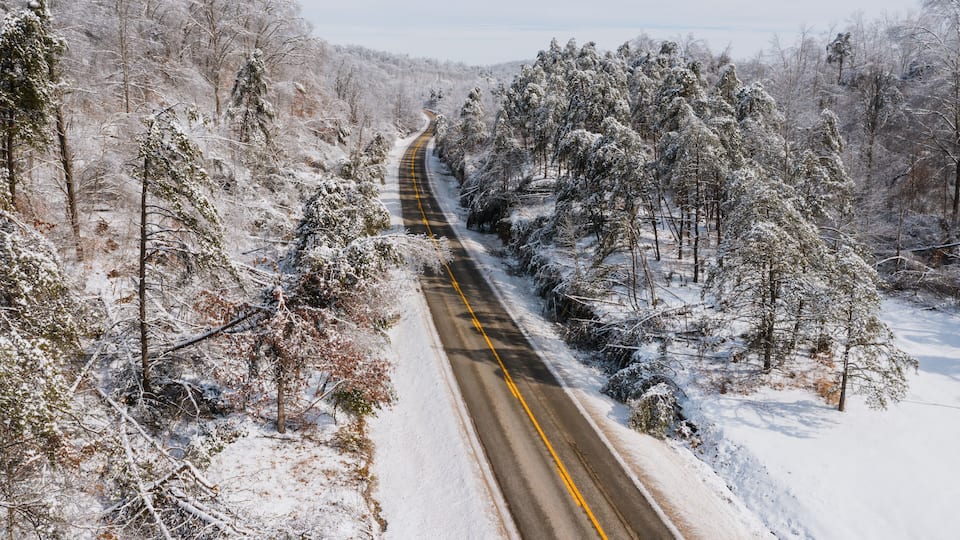 Aerial of KY Route 7 Surrounded by Snow Covered Forests - Grayson Lake State Park - Appalachian Mountains of Eastern Kentucky