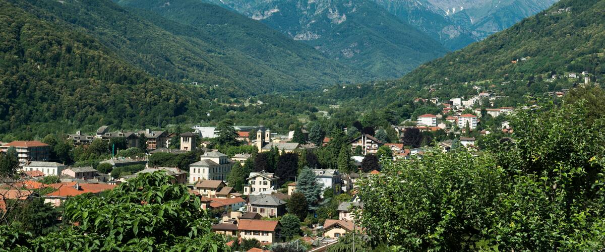 A mountainous landscape with a town nestled in a valley.