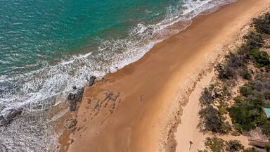 St Maarten and St Martin which includes general coastal views and a beach