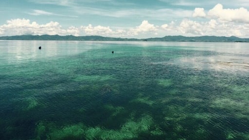 View from our water villa at El Nido Apulit Island Resort, Phillipines...don't know how but the sky always looks like this, clouds are on the horizon and sky will have shades of blue... Combined with pristine water is truly beautiful