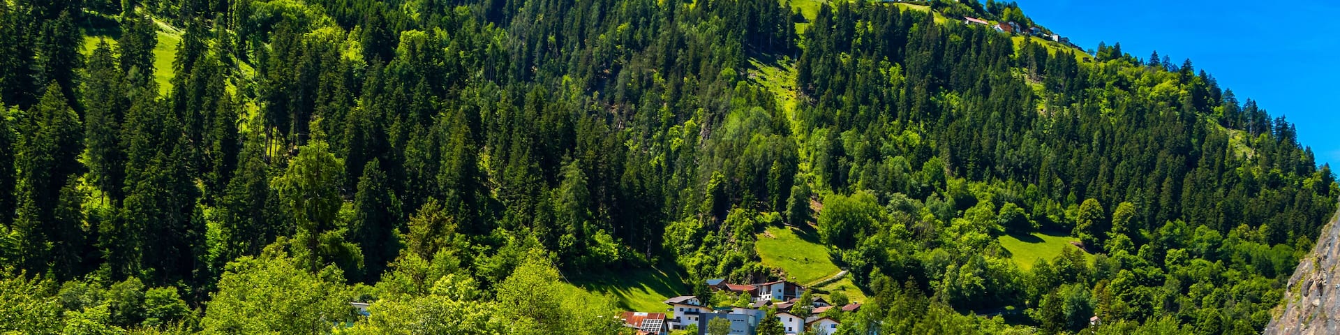 Austria alpine mountain landscape panorama with blue sky and nature.