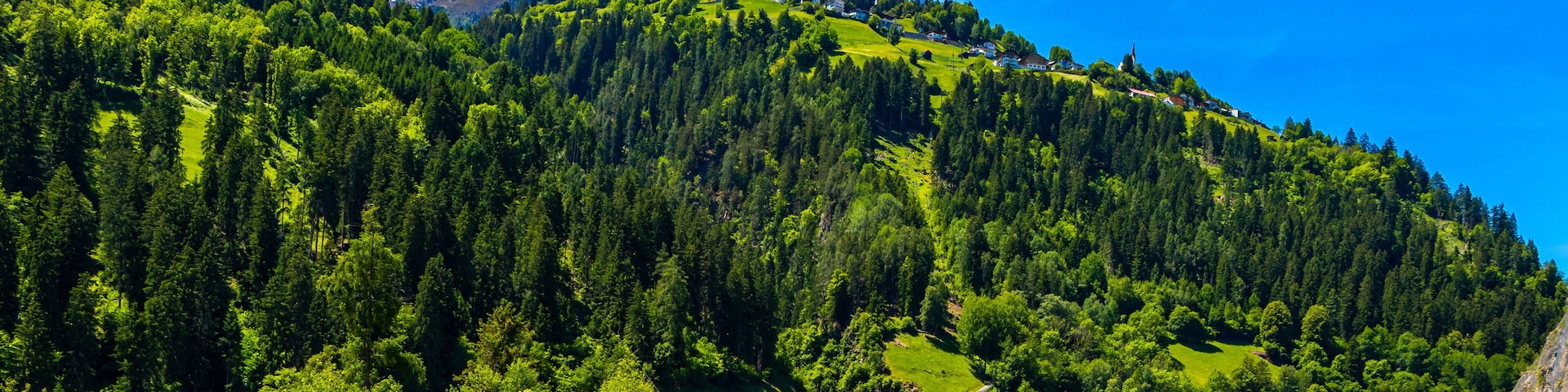 Austria alpine mountain landscape panorama with blue sky and nature.