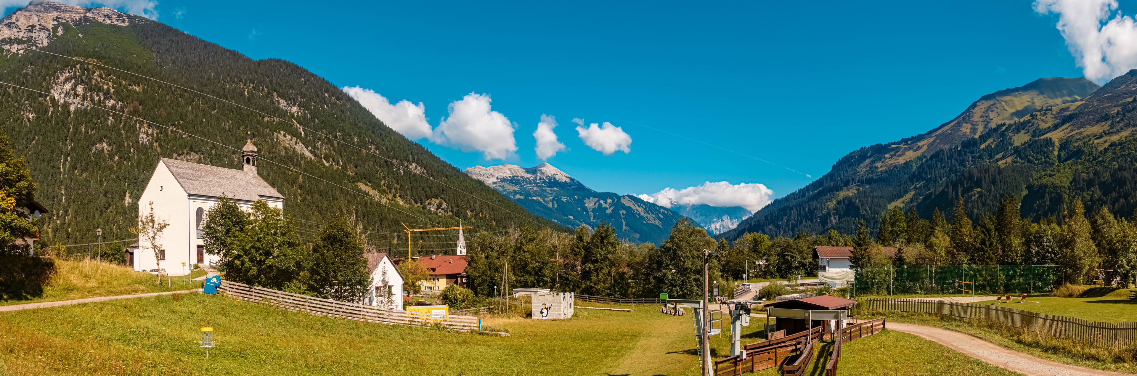 High resolution stitched panorama of a beautiful alpine summer view with the famous Zugspitze summit in the background at Bichlbach, Tyrol, Austria