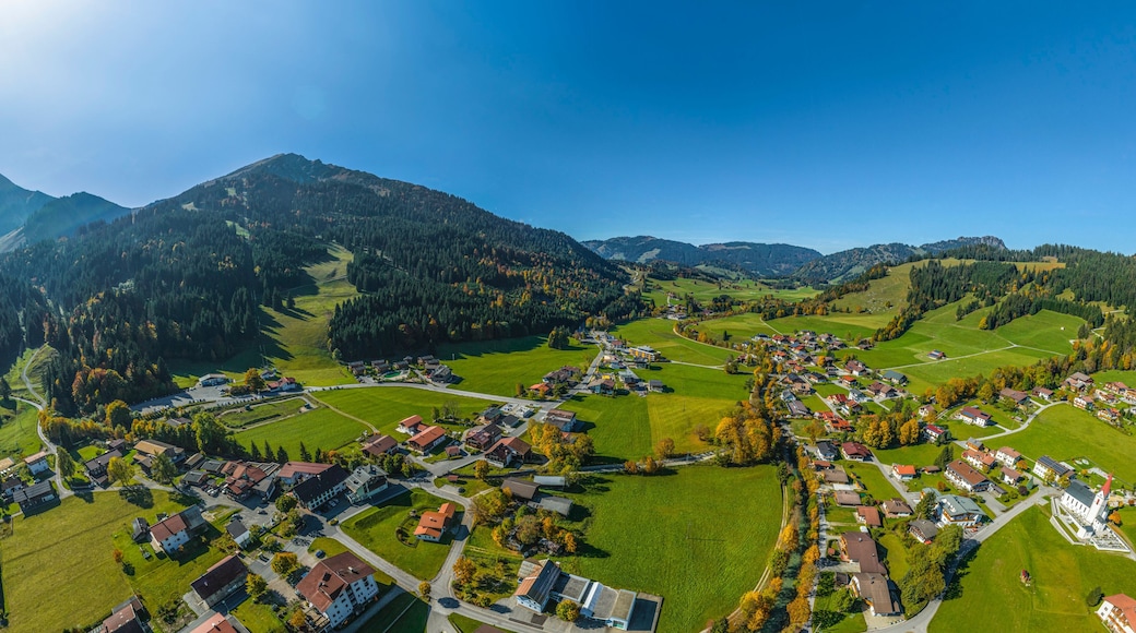 A mountainous landscape with a village nestled in the valley.