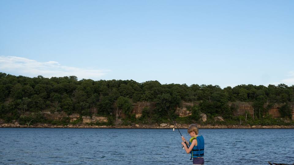 Boy Fishing At Osage Point In Skiatook Lake In Oklahoma