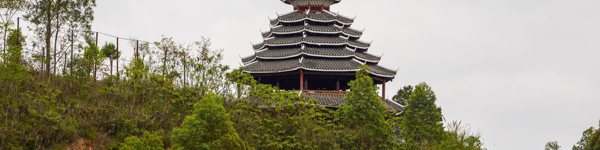 A pavilion in pagoda style of ancient Chinese architecture built on top of a hill