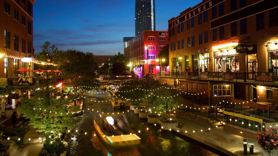 Bricktown showing night scenes, a high-rise building and a city
