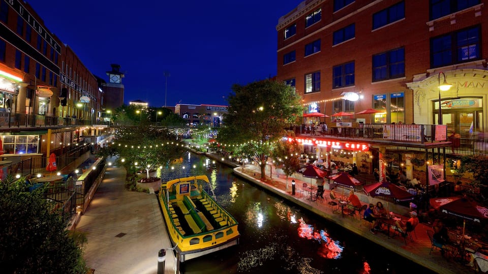 Bricktown showing a river or creek, outdoor eating and night scenes