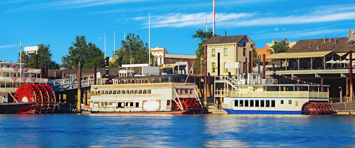 Historic Old Town Sacramento waterfront with riverboats and the Sacramento River,CA