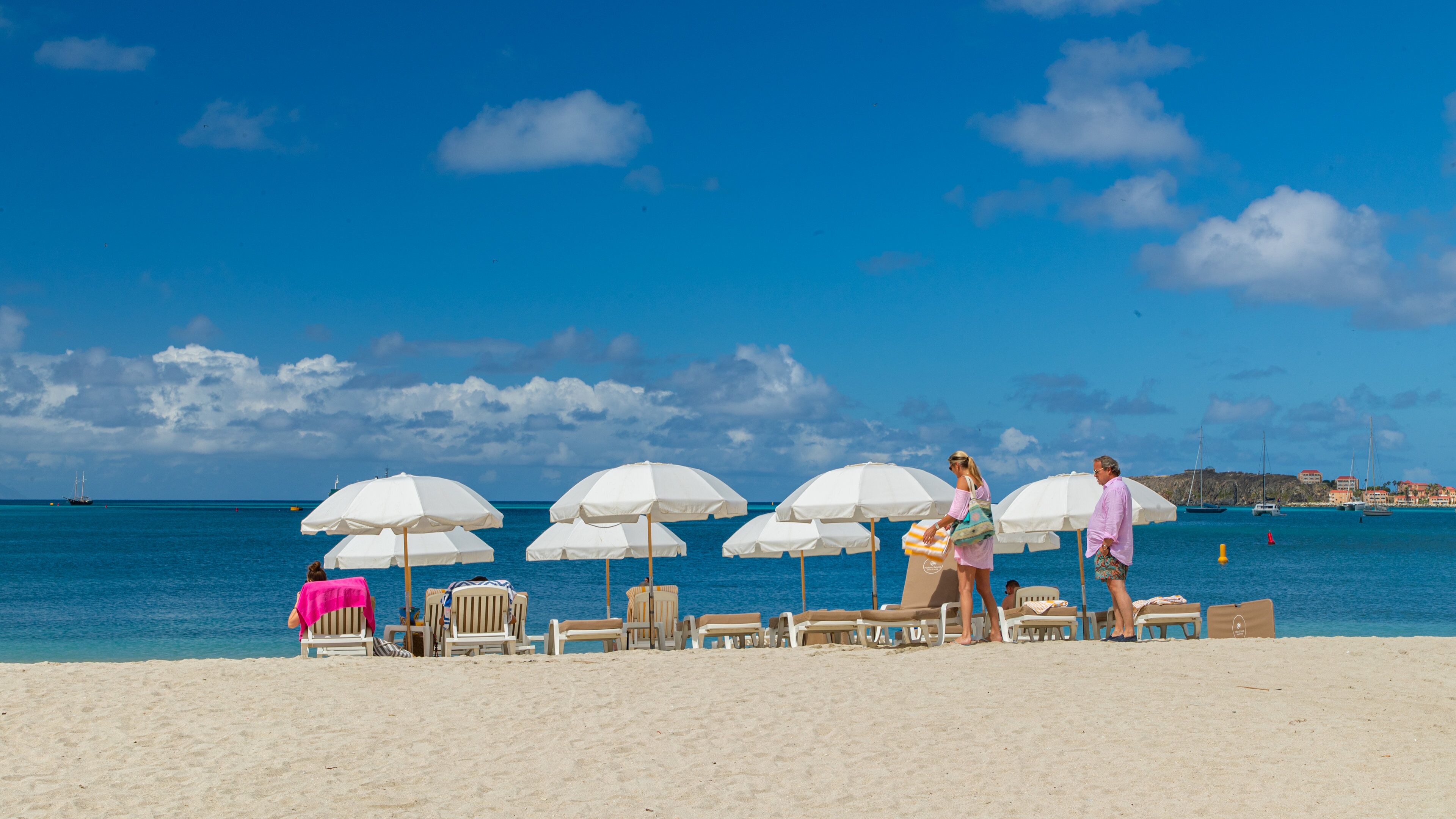 Great Bay Beach which includes general coastal views and a beach as well as a couple