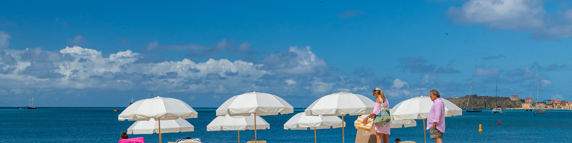 Great Bay Beach which includes general coastal views and a beach as well as a couple