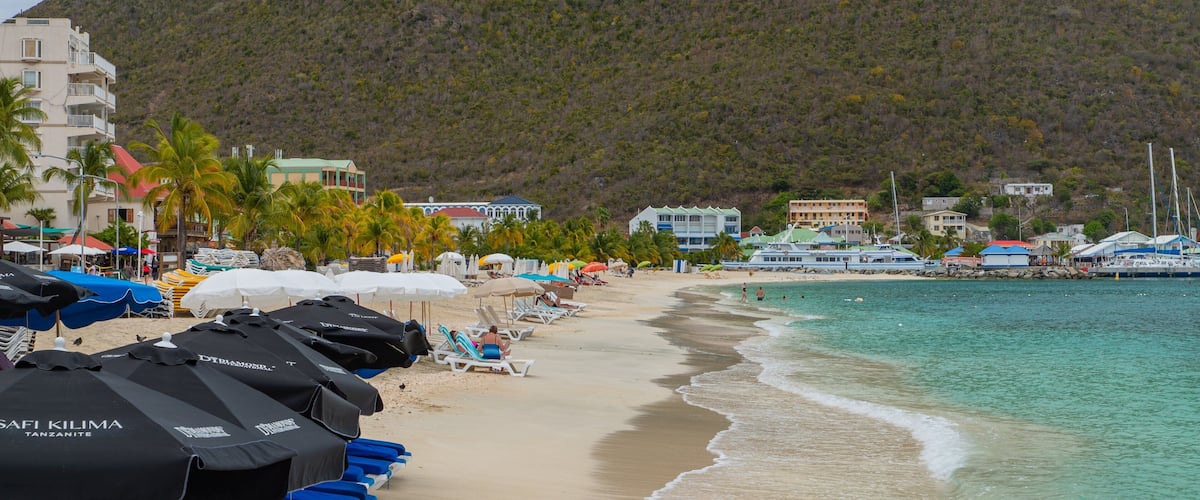 Great Bay Beach which includes a coastal town, a sandy beach and general coastal views