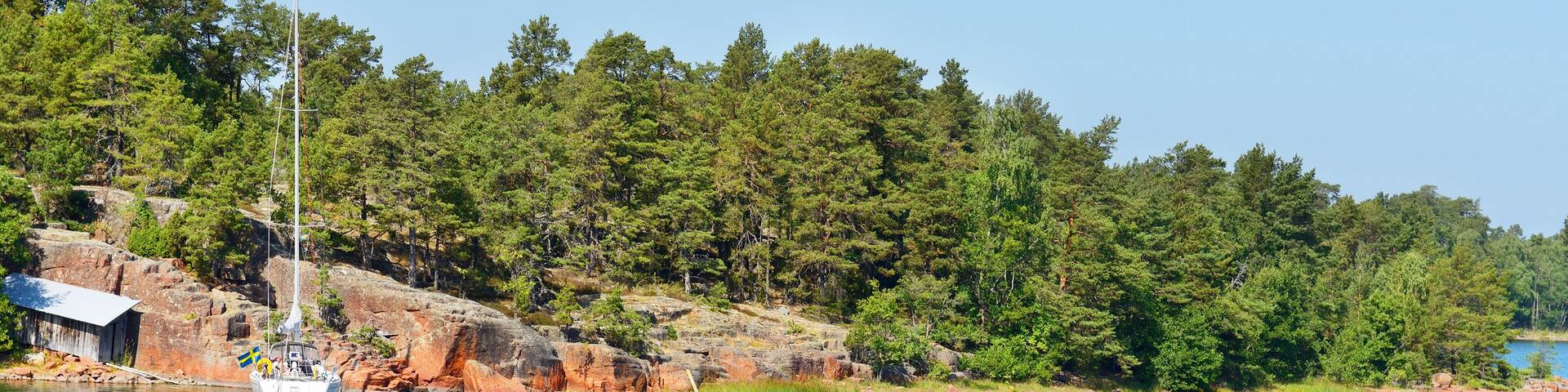 White yacht in the blue lagoon. Aland Islands