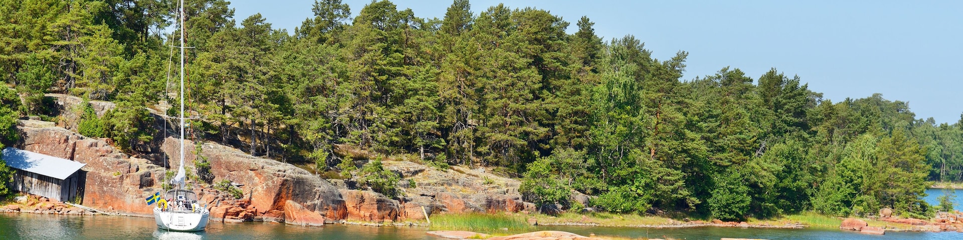 White yacht in the blue lagoon. Aland Islands