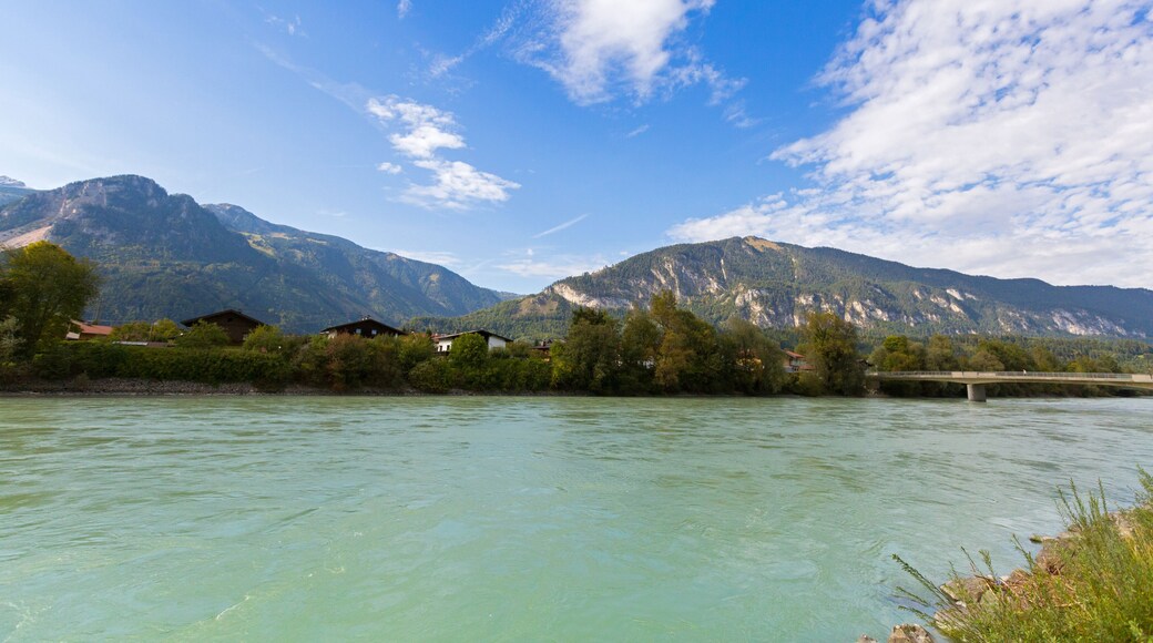 Inn river with big mountain, blue sky in background, in Rattenberg, Tyrol in Austria, Europe