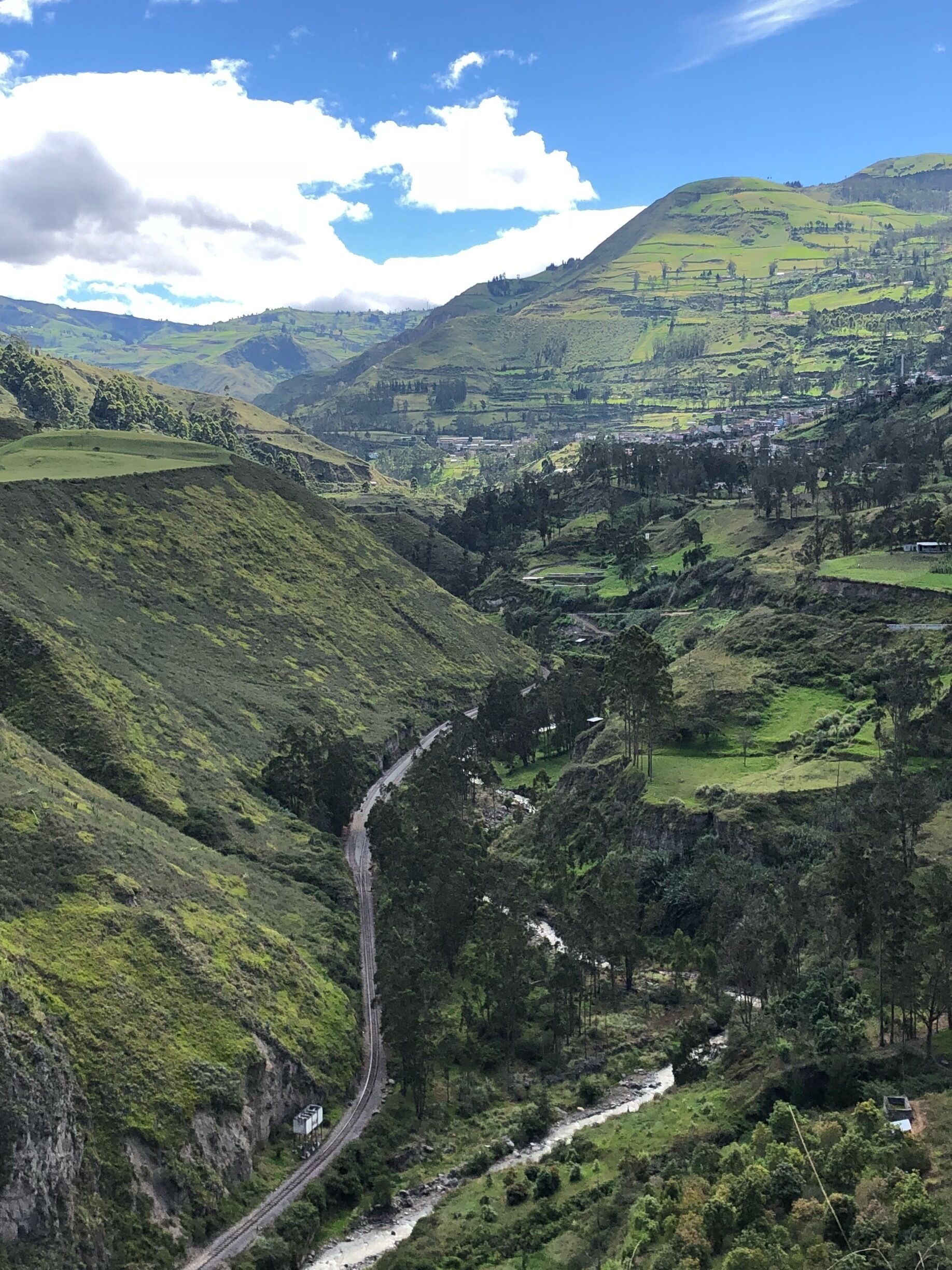 The Devil’s Nose train passes through the green valley 