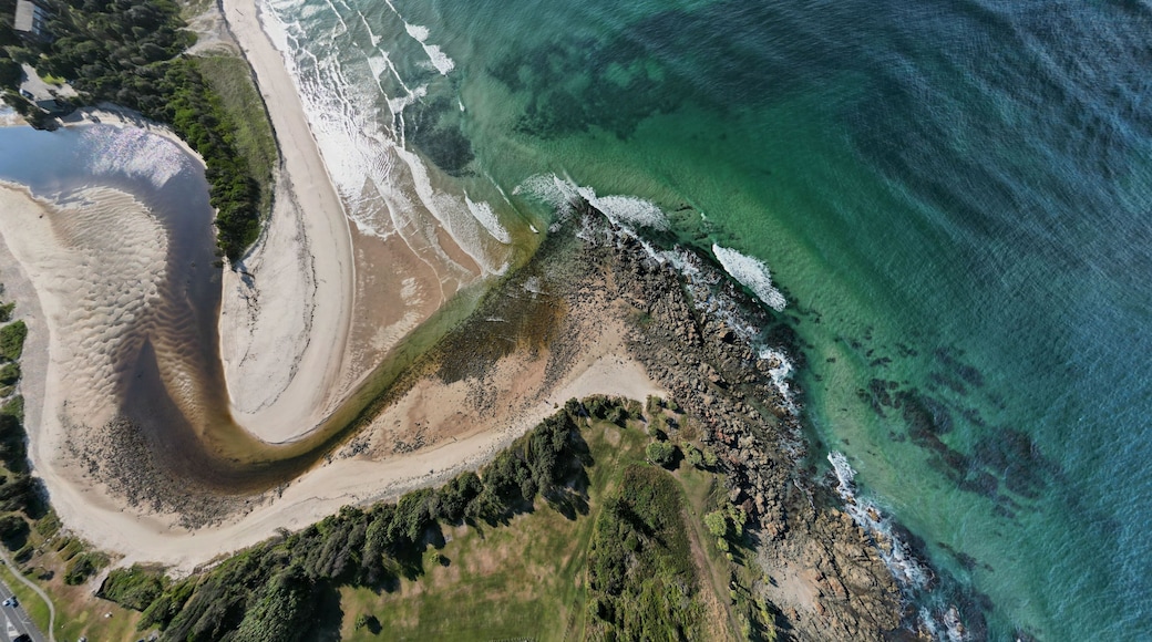 Aerial view the beach and river encounter of Hastings Point in Australia