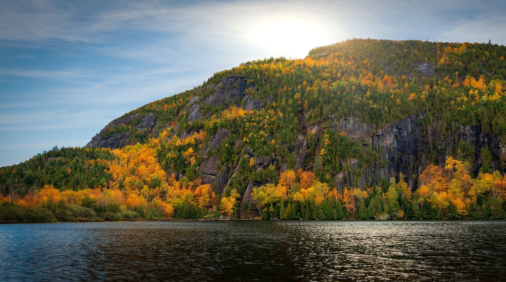 Panoramic view of Chapel Pond reflecting autumn colors in Keene Valley, the Adirondacks, New York
