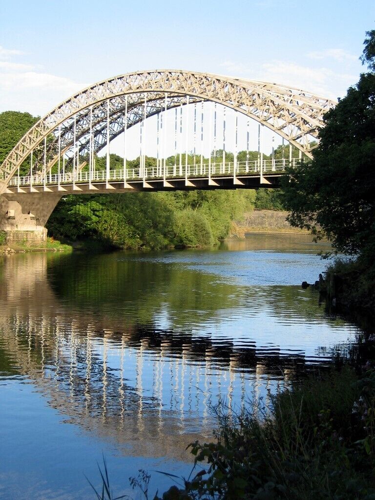 Points Bridge at Hagg Bank, near to Wylam, Northumberland, Great Britain. Hagg Bank Bridge (known locally as Points Bridge) is an early example of an arch suspension bridge. It was built in 1876 by the Scotswood, Newburn & Wylam Railway Company. The bridge allowed trains to cross the river from North Wylam Station to join the Newcastle to Carlisle line at West Wylam Junction. The Tyne bridge in Newcastle (1928) and the Sydney Harbour Bridge in Australia (1932) followed with similar designs.