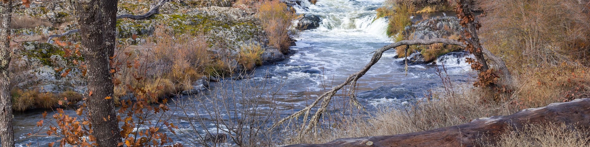 Beautiful view at spectacular Ti'lomikh Falls in late autumn. Location is Rogue River in Gold Hills, Oregon