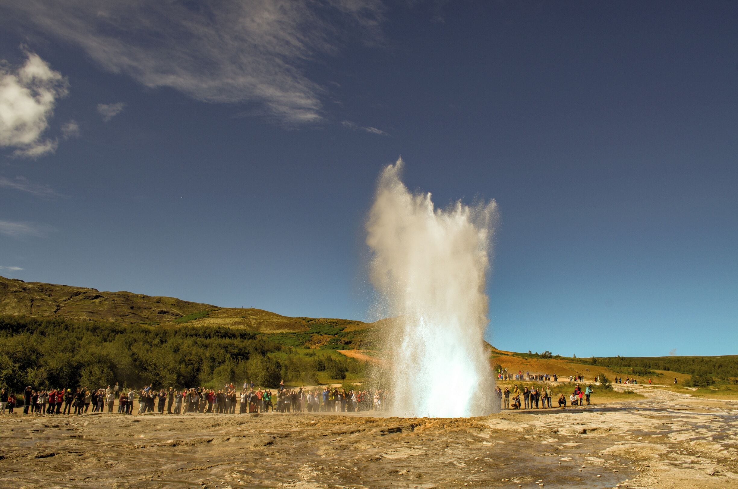 Geysir fields in Iceland, part of the Golden Circle tour. Geysir erupts every 8 to 9 minutes with varying plume heights. Photo taken with Nikon D51000 and kit lens on auto flash off mode, manual focus with repeat shots trigger to capture sequence of eruption. Shot in RAW.

