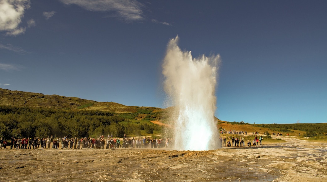 Geysir fields in Iceland, part of the Golden Circle tour. Geysir erupts every 8 to 9 minutes with varying plume heights. Photo taken with Nikon D51000 and kit lens on auto flash off mode, manual focus with repeat shots trigger to capture sequence of eruption. Shot in RAW.