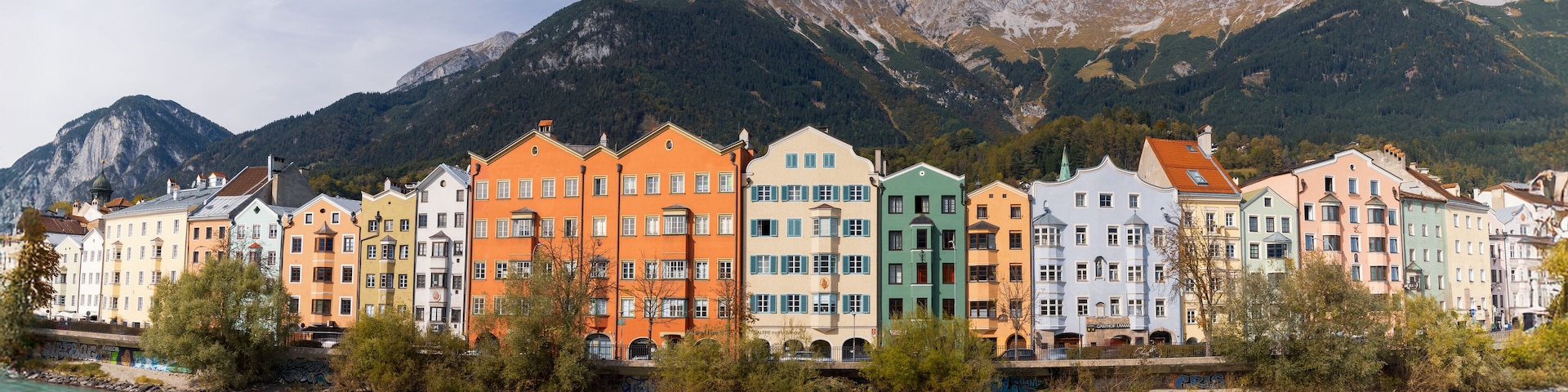 Panoramic view of colorful historic buildings in Innsbruck city, Austria.