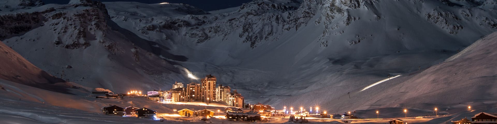 Tignes Val Clares at night shines in surrounded by mountain peaks; Shutterstock ID 128704817; purchase_order: SP-1332 HA Batch 2 August 2018; Order: ; client: HomeAway; other: To be paid with HA budge