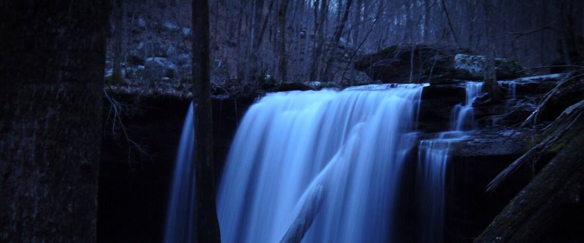 One of three big waterfalls on the Virgin Falls Trail in Scott's Gulf. Night time full moon slow shutter picture of Big Laurel Falls.