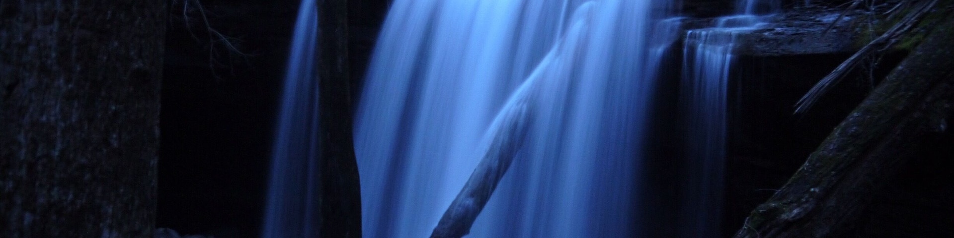 One of three big waterfalls on the Virgin Falls Trail in Scott's Gulf. Night time full moon slow shutter picture of Big Laurel Falls.