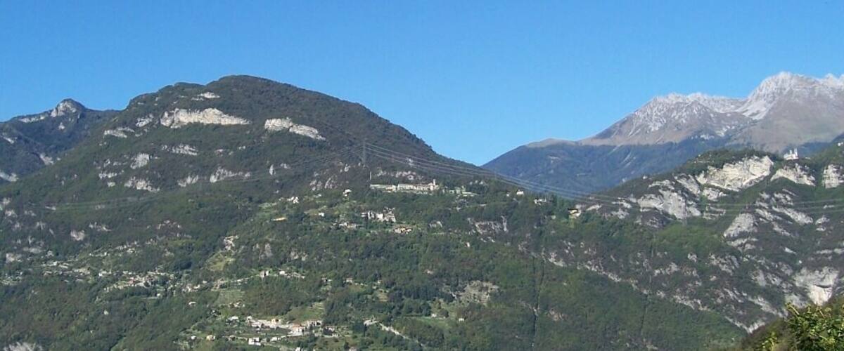 A mountainous landscape with a clear blue sky.