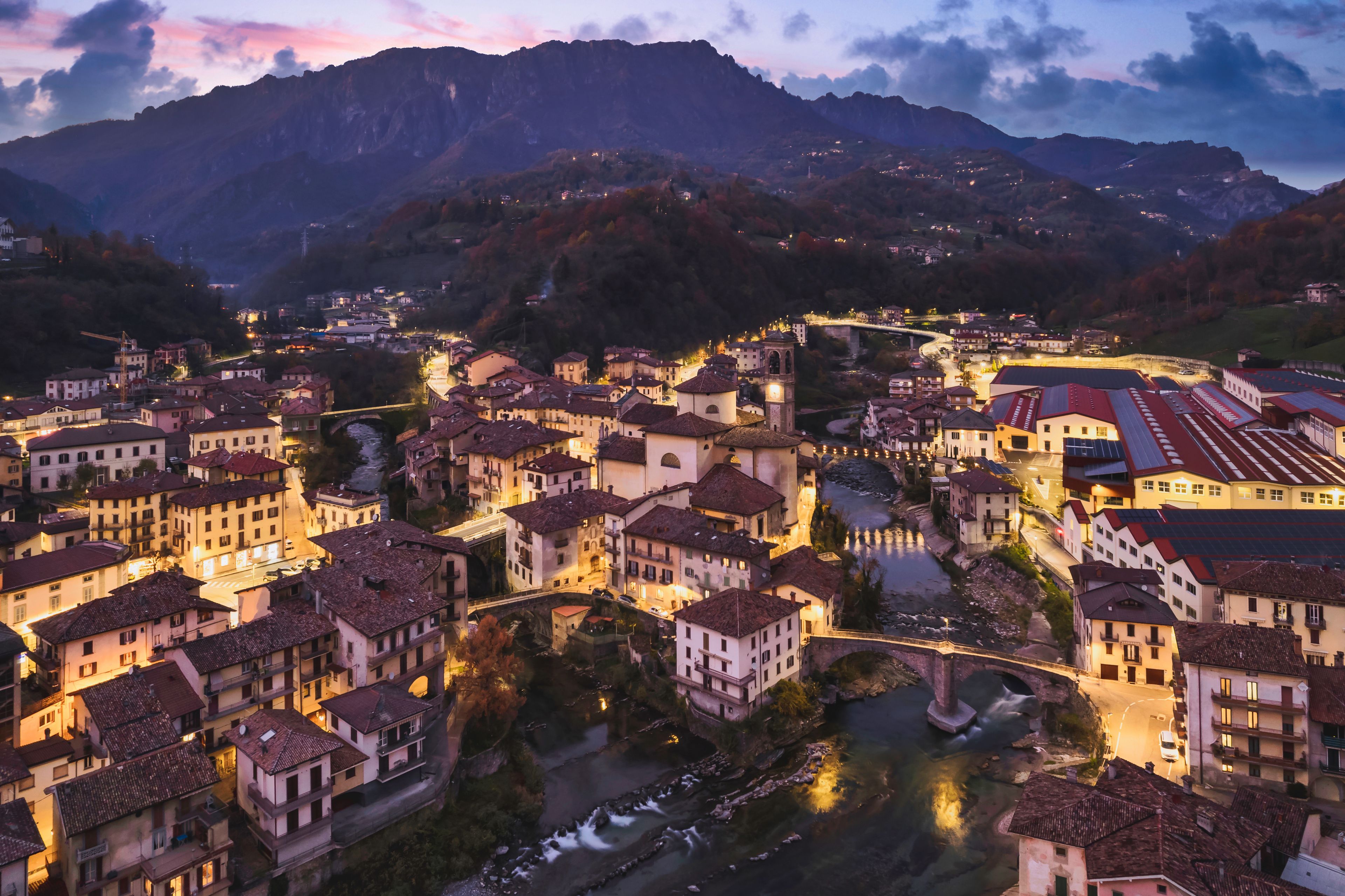 Beautiful aerial night cityscape of little town in Bergamo at blue hour, San Giovanni Bianco, Bergamo, Val Brembana, Lombardy, Italy