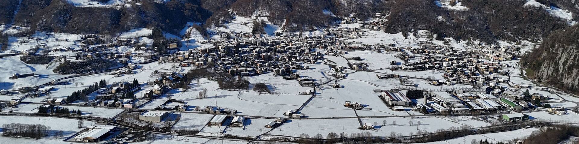 Aerial view of snowy Pasturo in Valsassina, Lombardy, Italy