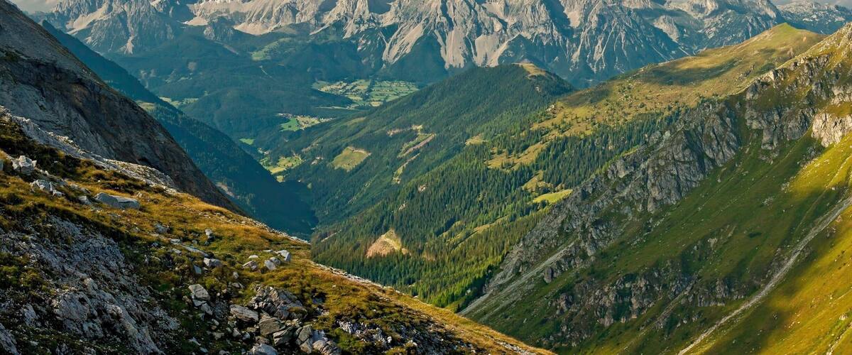 A mountainous landscape with rugged peaks and valleys.