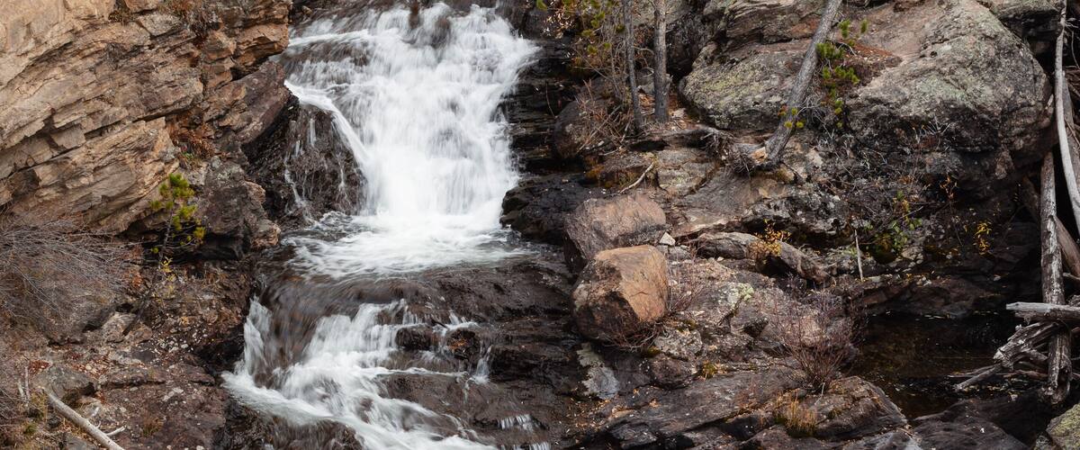 Vertical shot of Adams Falls Rocky Mountain National Park east inlet trailhead