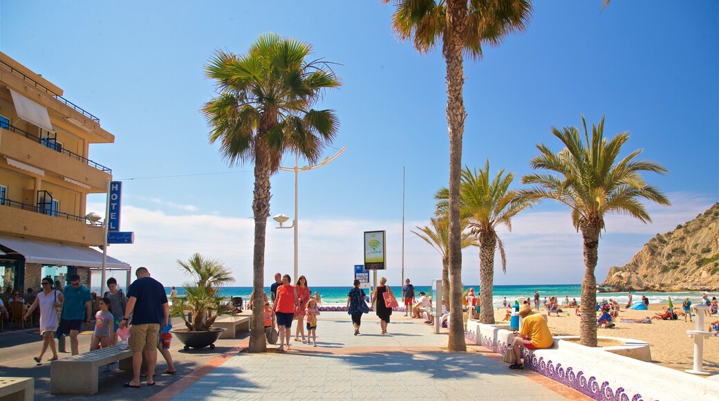 La Cala Beach featuring a coastal town as well as a couple