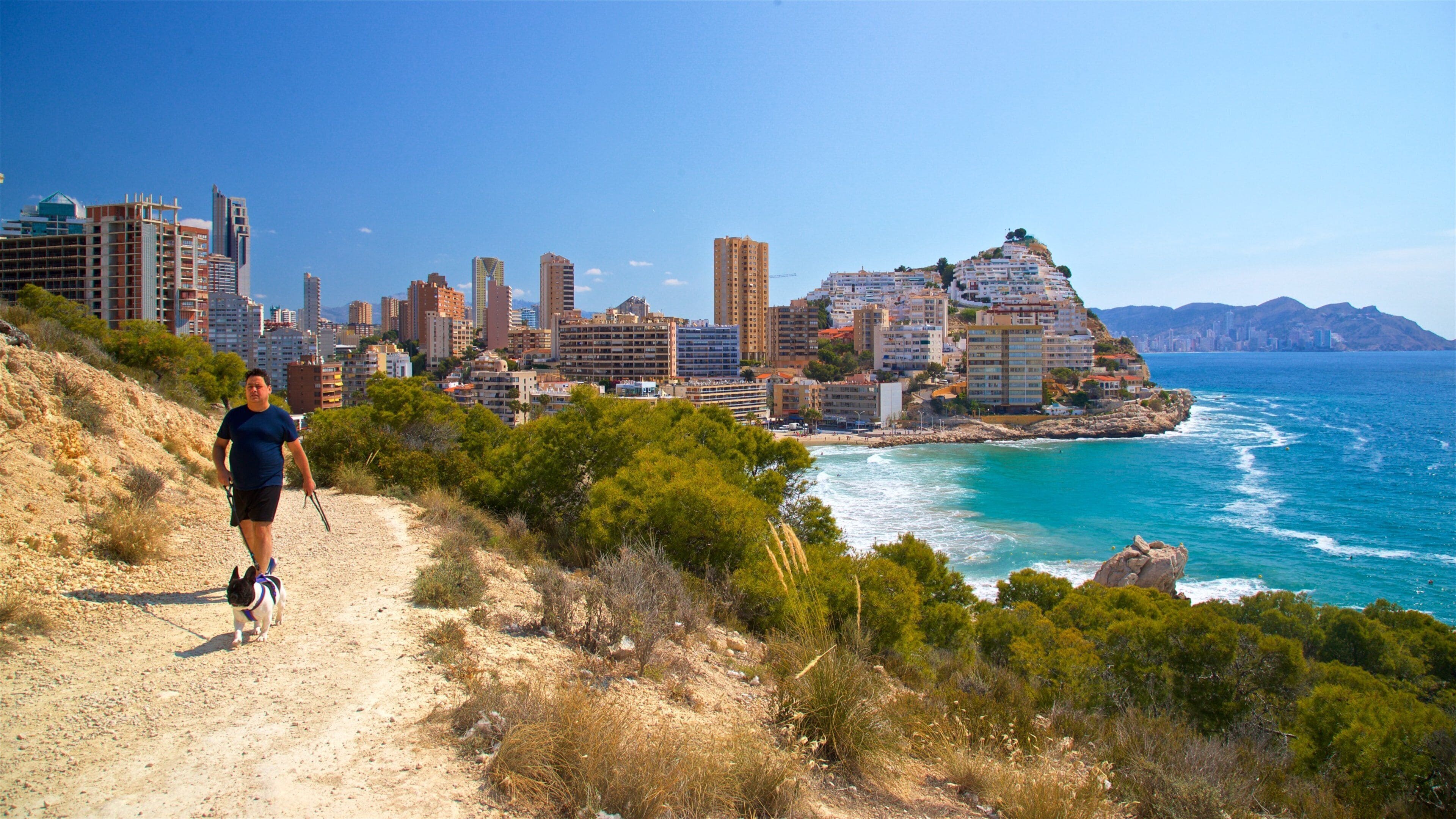 La Cala Beach featuring hiking or walking, general coastal views and a coastal town