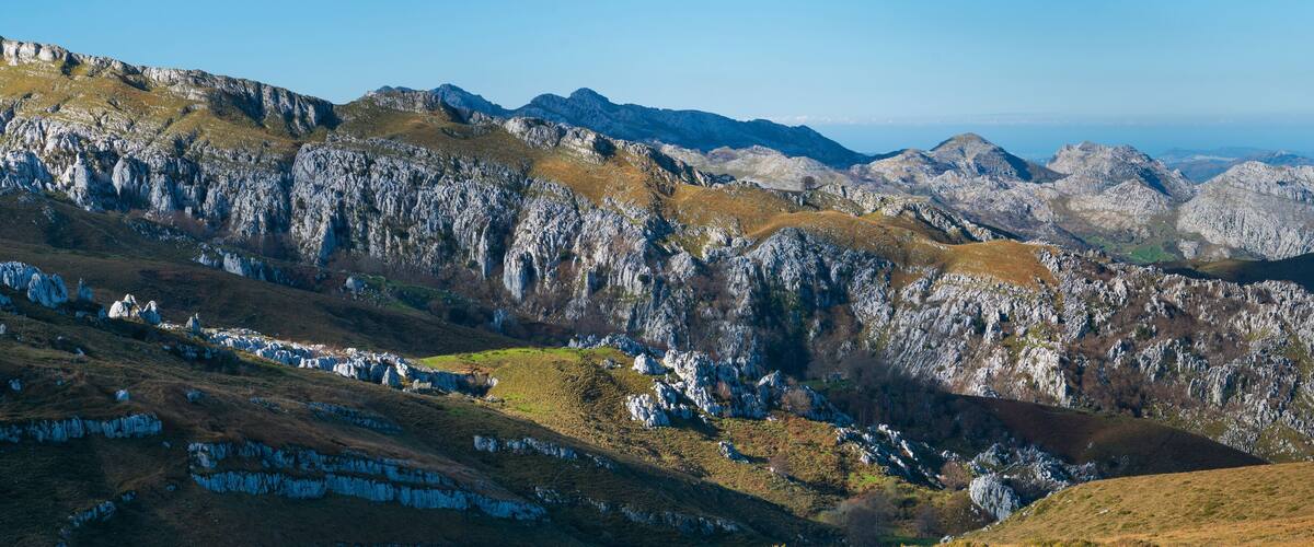 Rugged mountains with rocky outcrops and sparse vegetation.