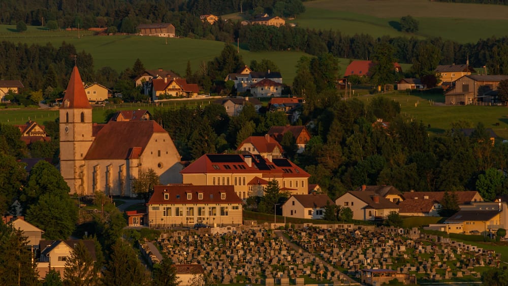 Semriach village with Schockl hill over in sunset sunny evening