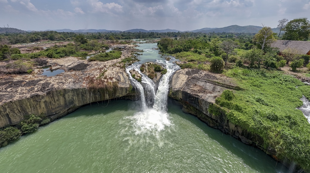 Aerial view of the dramatic cascade of Dray Nur Waterfall plunging into the river amidst lush greenery, Buon Ma Thuot, Dak Lak, Vietnam.