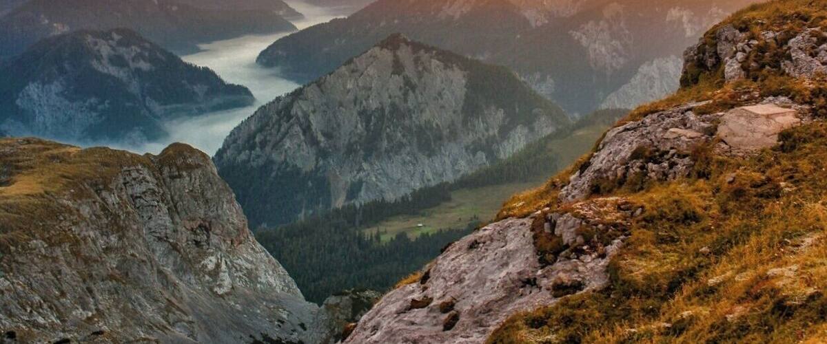 September 2016
Schiestlhaus, Hochschwab, Styria, Austria
Early sunset view north from Schiestlhaus hut (alt. 2.157 meters) in the middle of Hochschwab mountain range. The mist marks the valley of river Salza some 1.500 meters below. There are basically no lifts in the Hochschwab, so you can enjoy it in its natural state. In September the weather is quite stable and only few tourists which get such rewarding views for the pain of hiking it by own feet.