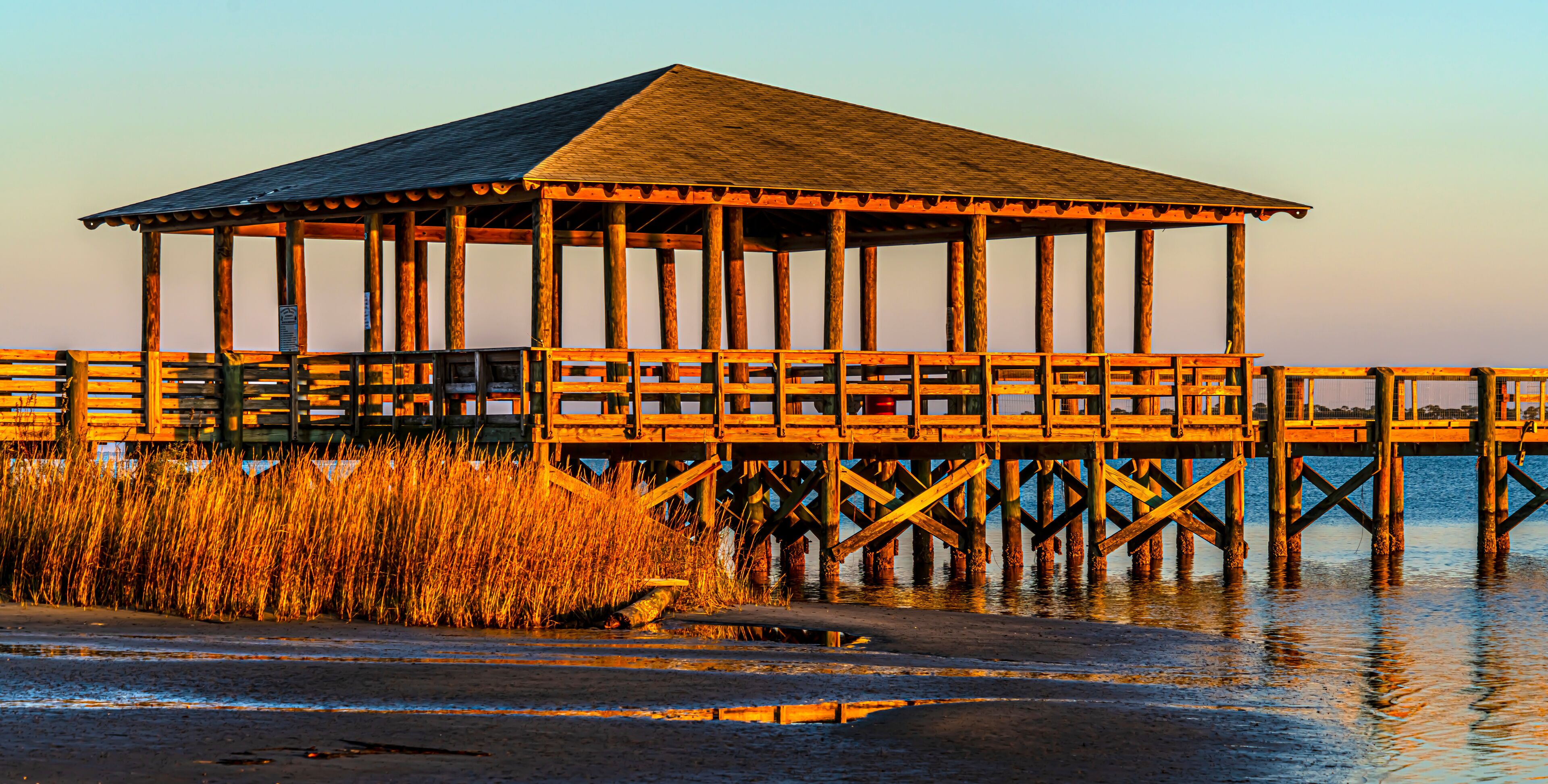 Pier plus covered picnic areas on the Gulf in Long Beach Mississippi area, late light.