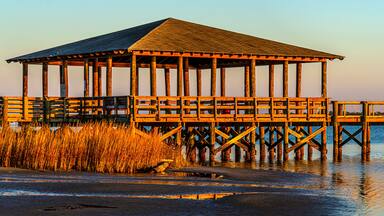 Pier plus covered picnic areas on the Gulf in Long Beach Mississippi area, late light.